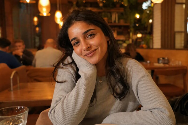 Portrait under a warm kitchen bulb showing an orange colour cast on skin