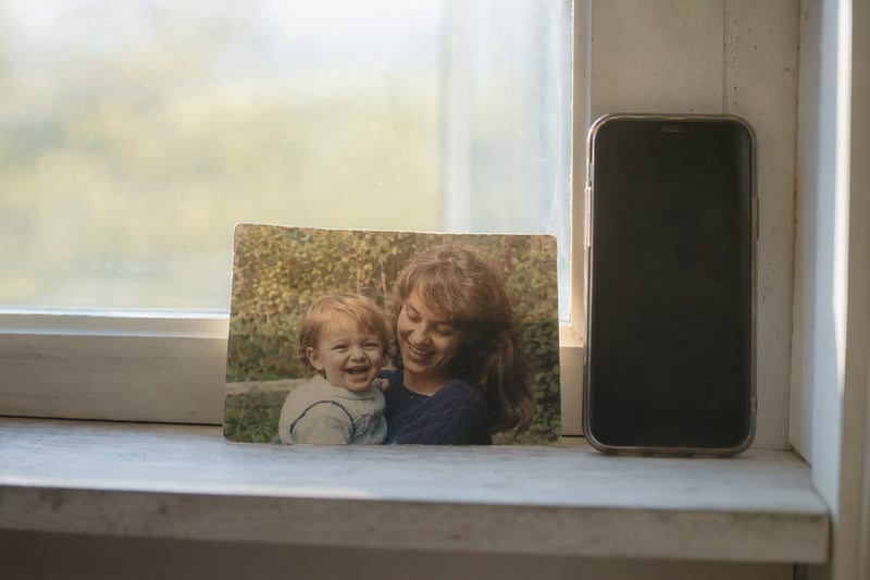 A laptop screen showing the same photograph before and after an enhancement pass