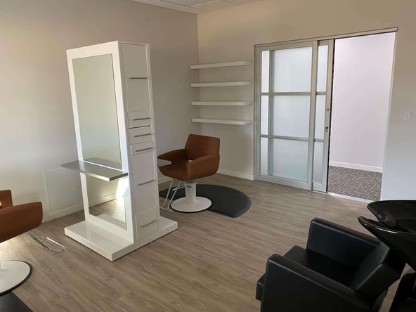 Fully furnished hair salon suite located at The Suite Emporium in Holstein, IA