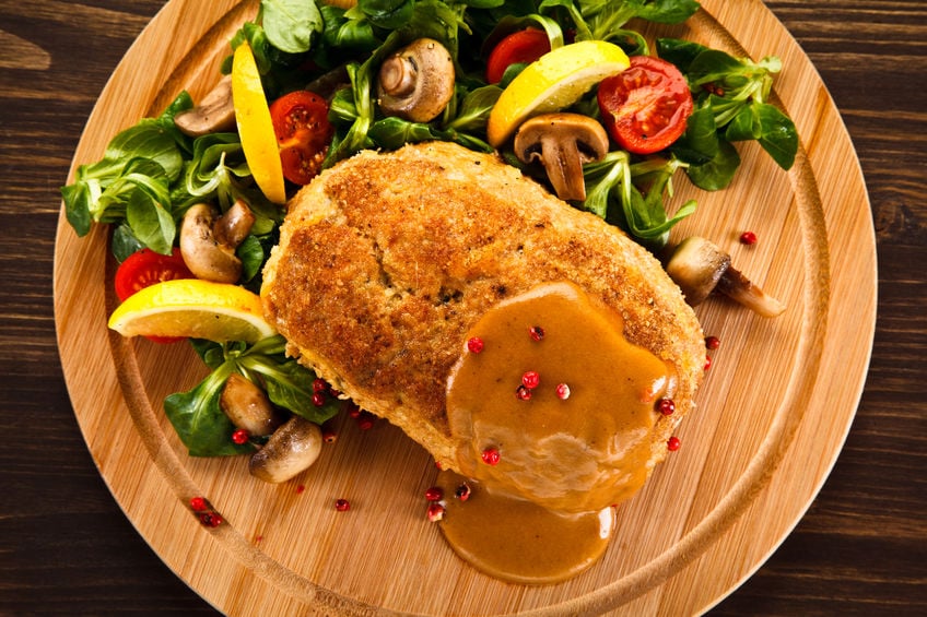 Goat cheese stuffed pork chop with roasted veggies