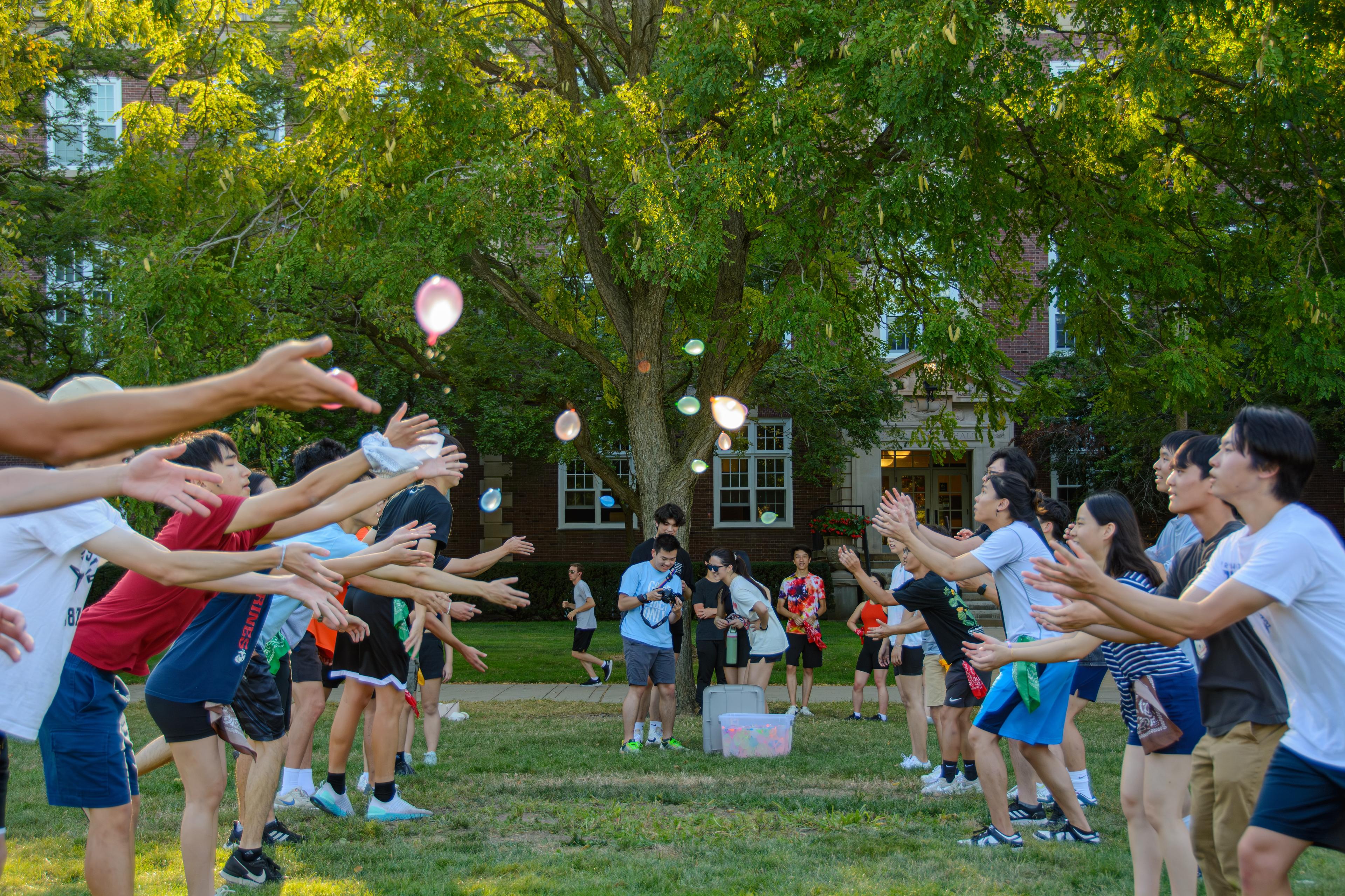 Balloon toss game during TASC's Welcome Back Week Field Day