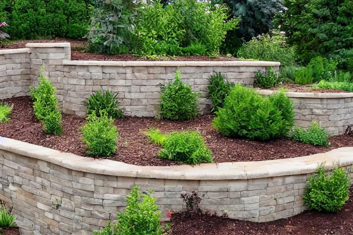 Retaining wall with mulch and shrubs