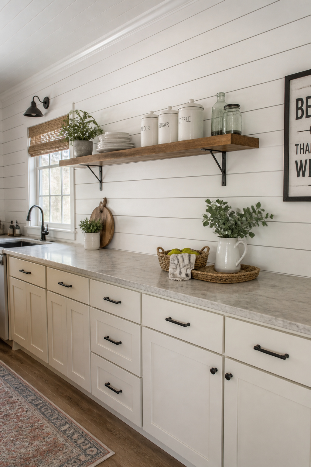 White painted shiplap with characteristic shadow lines creates the signature farmhouse wall texture — here paired with raw steel shelf brackets and cream lower cabinetry.
