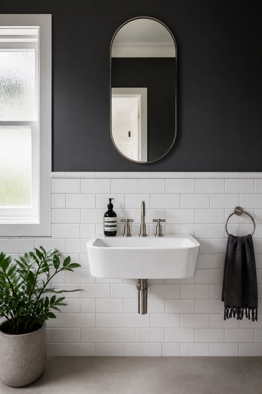 Half-wall tiling with a bullnose cap at 1100mm — the horizontal register of the dado creates proportion and grounds the bathroom's design in a way that floor-to-ceiling tile does not.