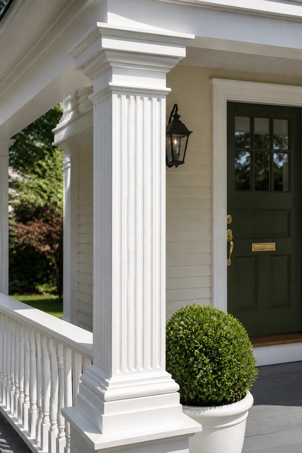 A freshly painted column — right down to the base and capital — delivers the visual impact of a full renovation for the cost of an afternoon and a can of exterior paint.