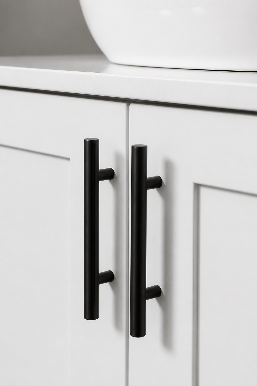 Matte black bar handles on a white vanity — a 20-minute swap that transforms the piece and one of the most cost-efficient bathroom ideas on a budget.