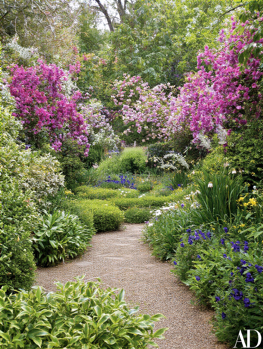 Close-up portrait of a backyard garden with row covers, beneficial insects like ladybugs, and a hand lens highlighting integrated pest management techniques under warm sunlight
