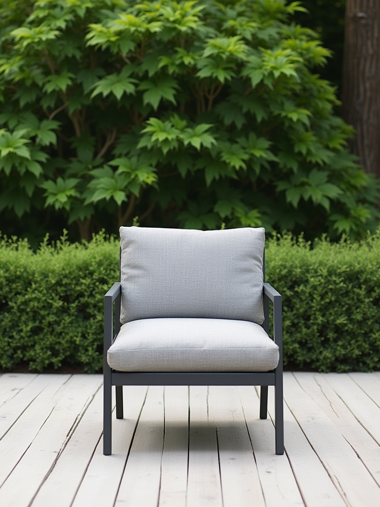 Modern composite deck at twilight showing a discreet, integrated pop-up electrical outlet providing power to an outdoor lamp and charging smartphone, with soft pathway lighting.