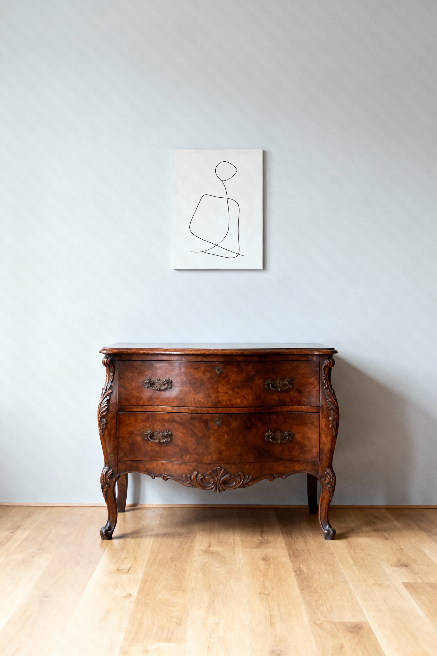 Elegant bedroom with a vintage carved dresser against a minimalist wall, showcasing balanced vintage and modern design without clutter.