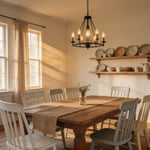 The complete rustic dining room: reclaimed wood table, mismatched farmhouse chairs, Edison chandelier, open shelving, and layered natural textiles working together in a warm, inviting space.