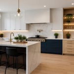 A contemporary kitchen brings together three distinct cabinet design styles in one cohesive space — shaker uppers, handleless navy lowers, and white oak open shelving showing how different styles can coexist when proportion and material are handled with precision.