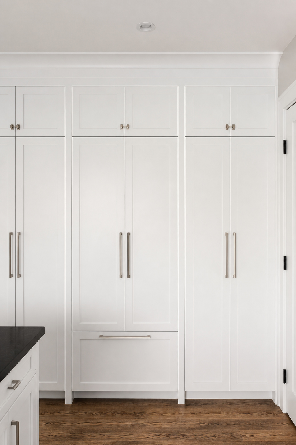 A panel-ready integrated refrigerator dressed in a matching cabinet panel creates a continuous wall of cabinetry — the appliance becomes architecture rather than an object, but requires specifying panel-ready appliances before the cabinet design is finalised. The seamless kitchen — refrigerator, dishwasher, and oven face all dressed in matching cabinet panels — represents the furthest point on the spectrum from appliances as objects to appliances as architecture.