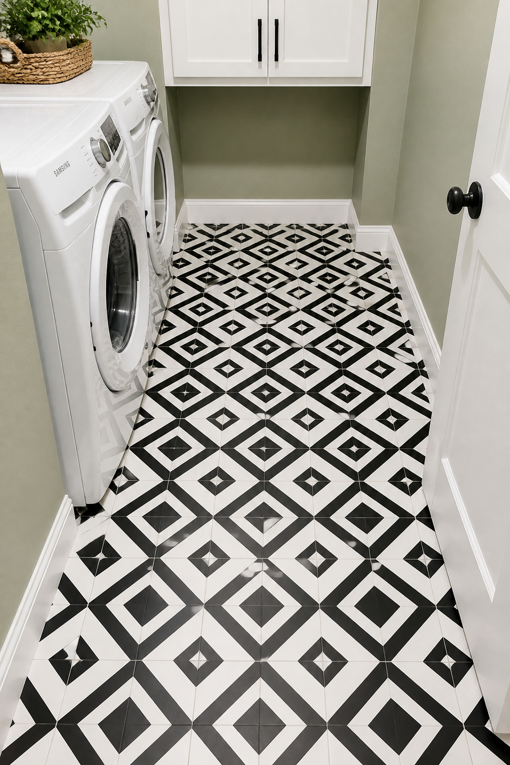 Black-and-white peel-and-stick geometric tiles cost under $150 for a small laundry room and deliver a pattern that would cost ten times as much in ceramic.