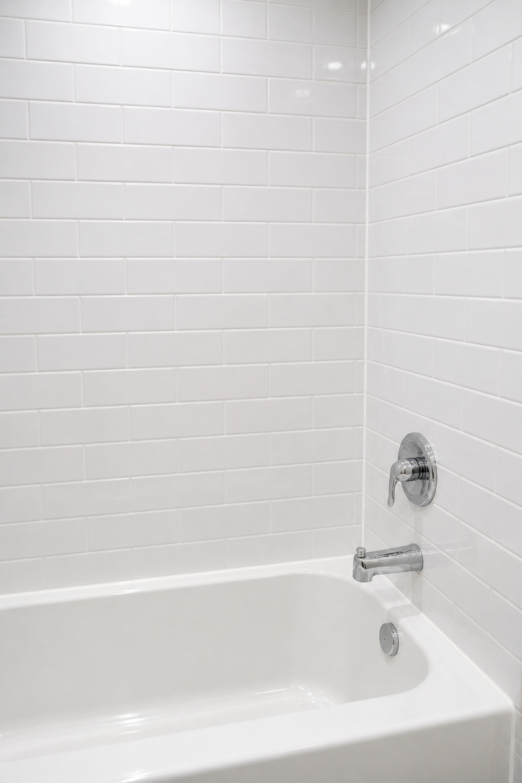 Fresh grout and caulk on original tile — the most underestimated move in bathroom remodeling, and one of the few where $100 in materials and a weekend of work delivers results this visible.