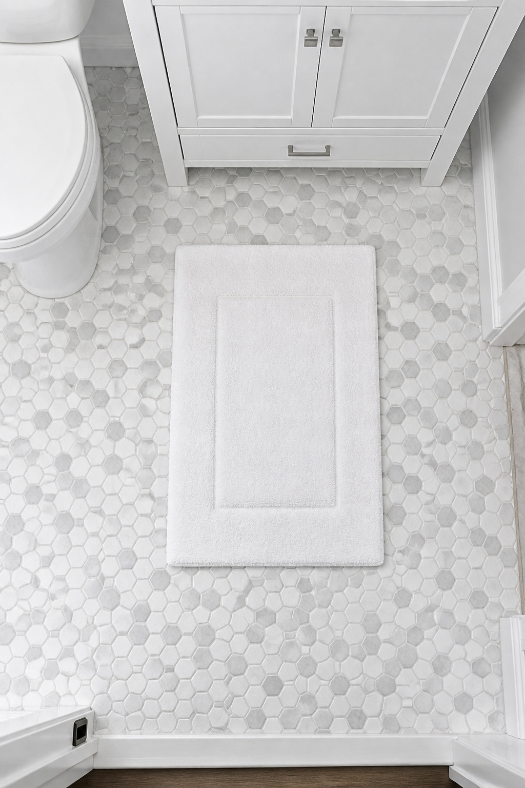 Peel-and-stick hex tiles over an existing bathroom floor — under $3 per square foot installed, with no demolition, adhesive, or grout required.