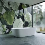 A modern bathroom design showcasing deep green Kolmården marble walls and silk-brushed Norwegian Oppdal slate flooring under soft natural light.