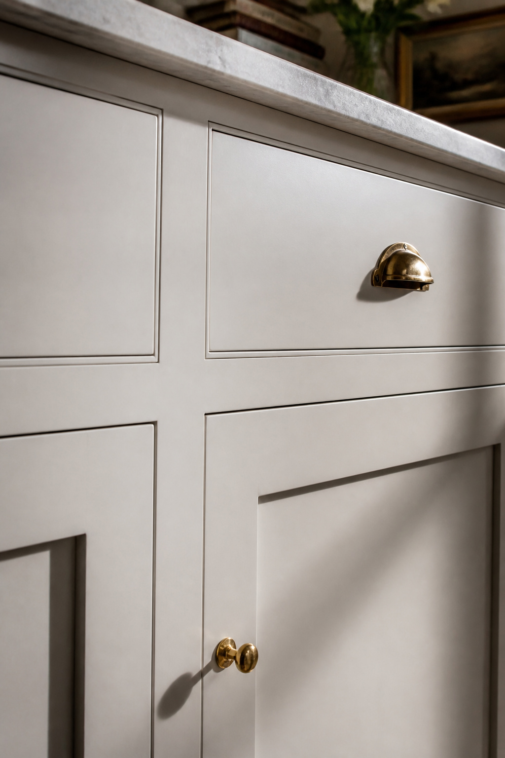 The 1/16-inch reveal line of a flush-inset Shaker island cabinet door — the detail that signals furniture quality.
