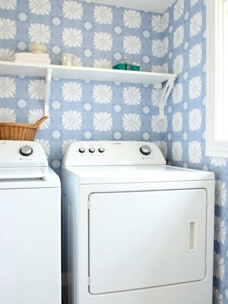 Bright laundry room with blue and white geometric peel and stick wallpaper