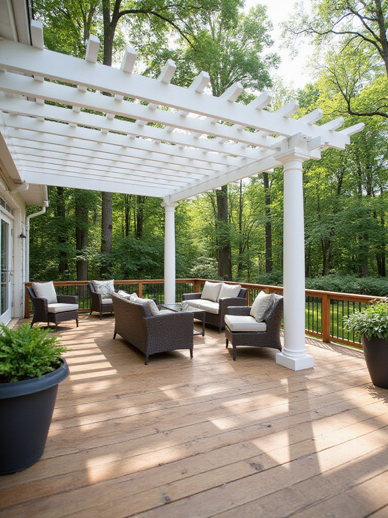 Wooden deck with a white vinyl pergola providing shaded seating.