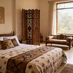 A beautifully arranged bedroom incorporating Vastu Shastra and Feng Shui, featuring authentic Indian textiles, a carved wooden screen, and a tranquil color palette, no people.