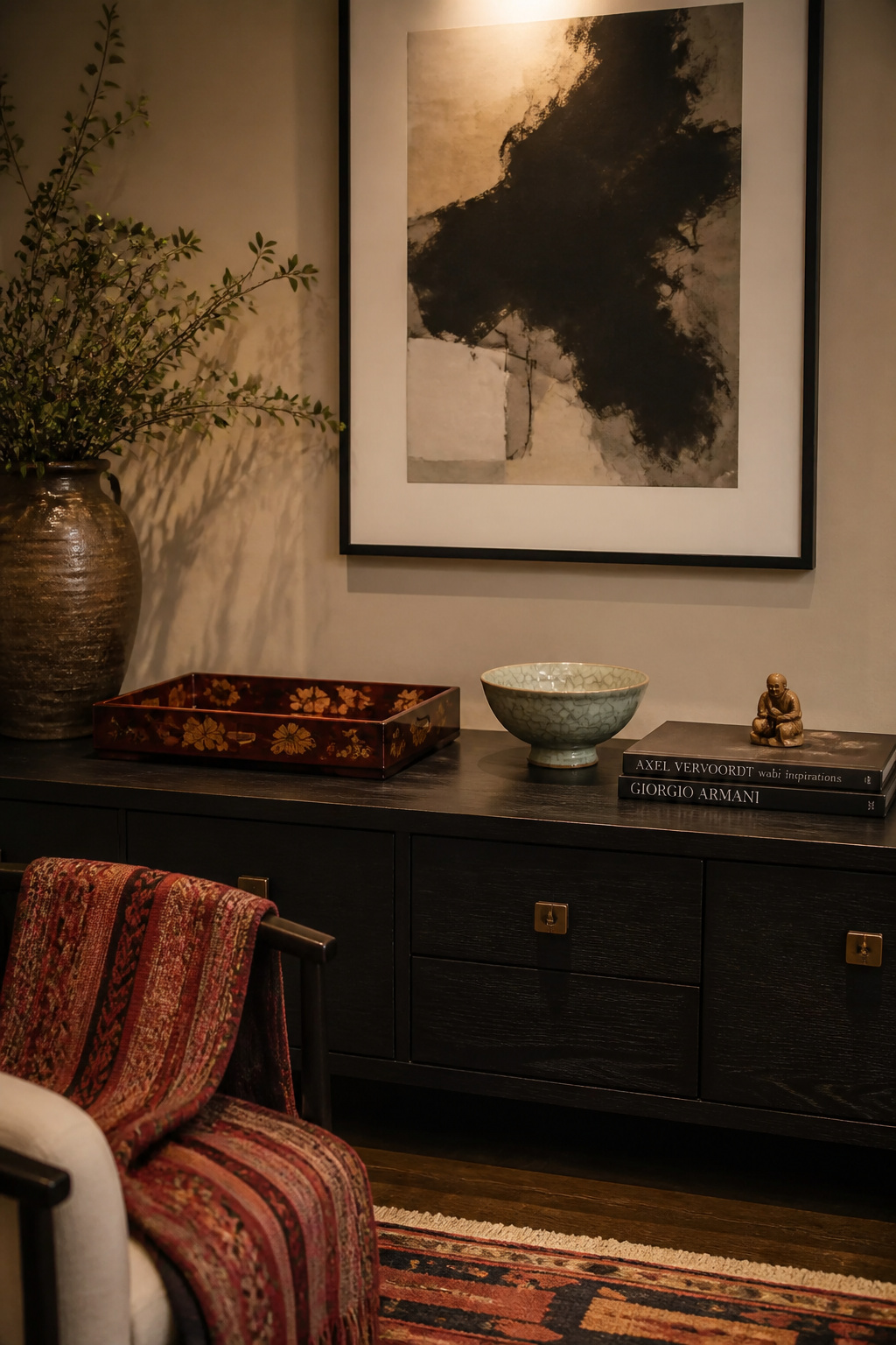 A console styled with culturally meaningful objects as design equals — Vietnamese lacquer, Korean celadon, Oaxacan textile — each piece in contemporary context without losing its story.