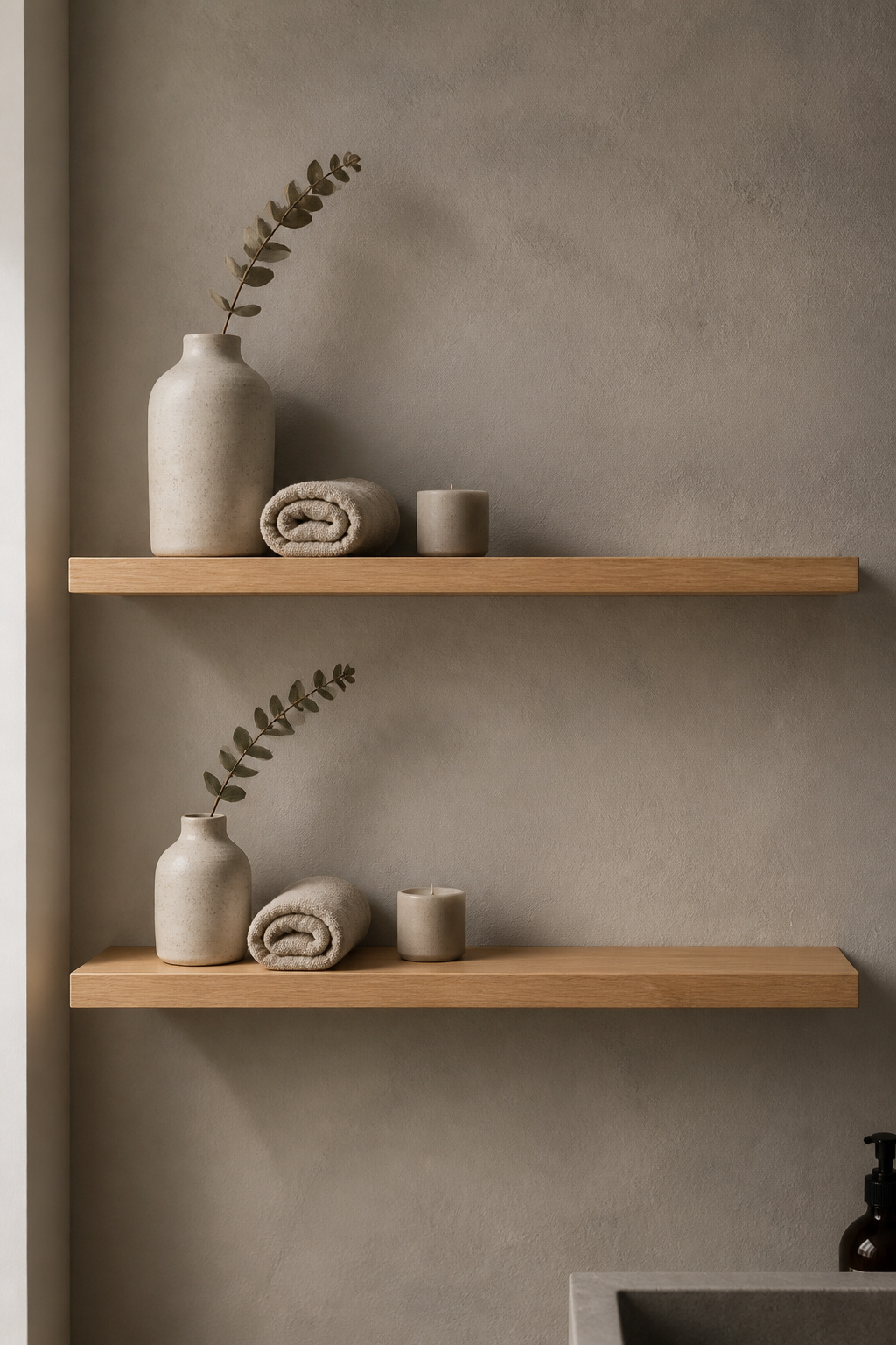 Styled bathroom open shelving follows the rule of three — grouping objects in odd numbers with deliberate negative space between them.