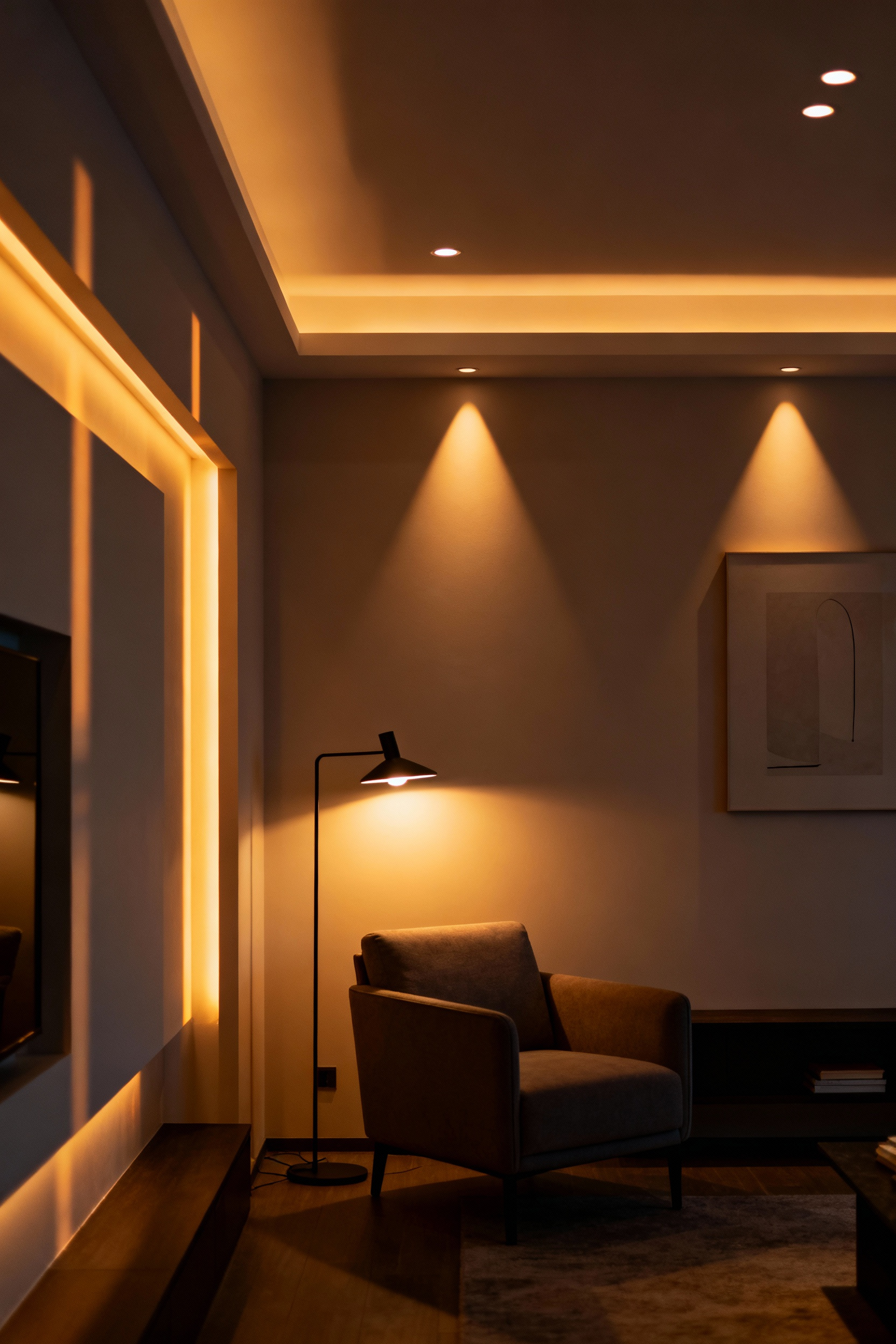 Modern living room showcasing strategic layered lighting with recessed lights, cove lighting, and a contemporary floor lamp creating warm ambience and defined task areas. No people.