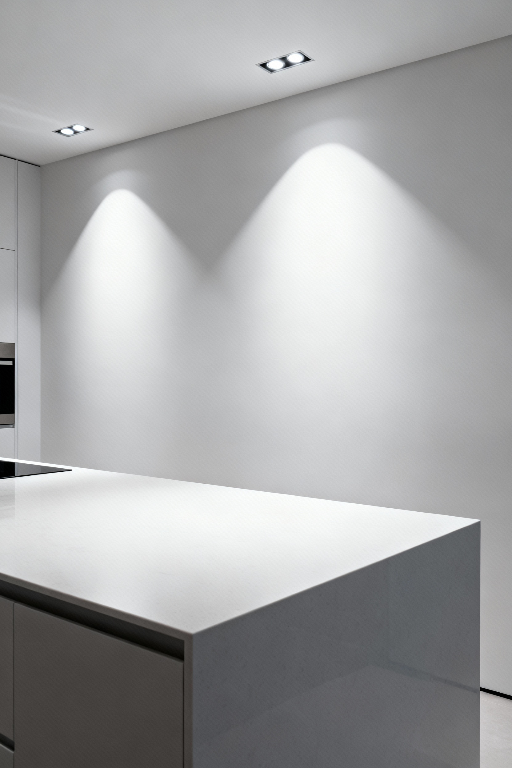 Modern kitchen island with precise, shadow-free directional LED lighting demonstrating ergonomic task illumination and wellness design.