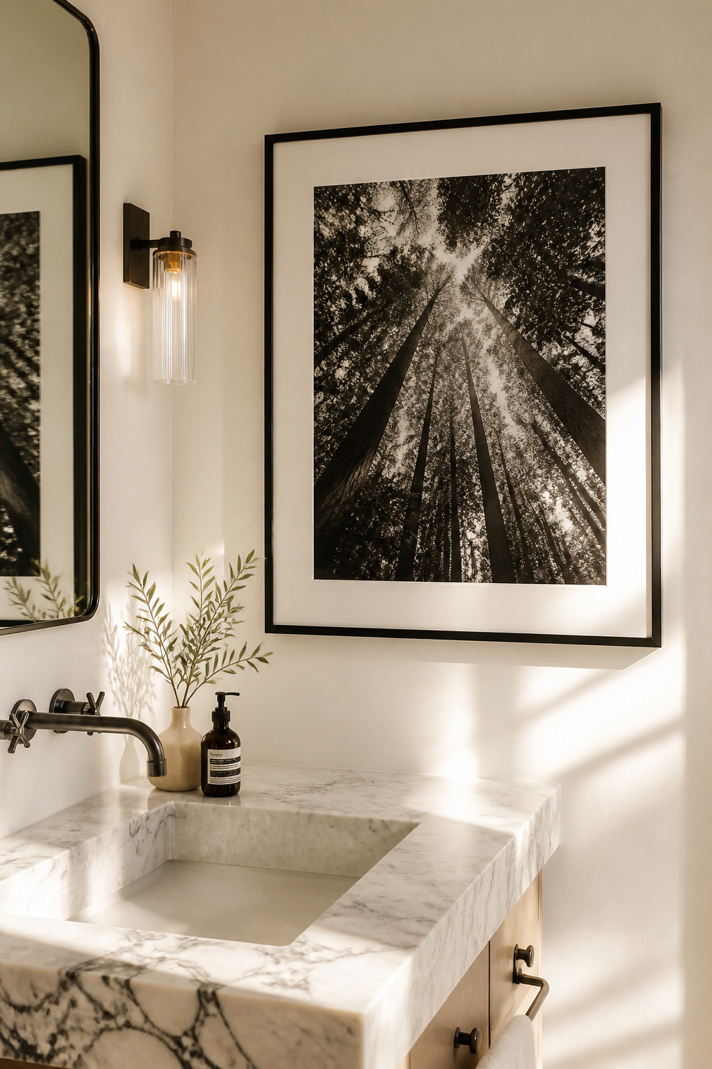 Monochrome forest canopy photography removes colour competition from a bathroom wall entirely, producing a contemplative, spa-like quality that works with any existing palette.