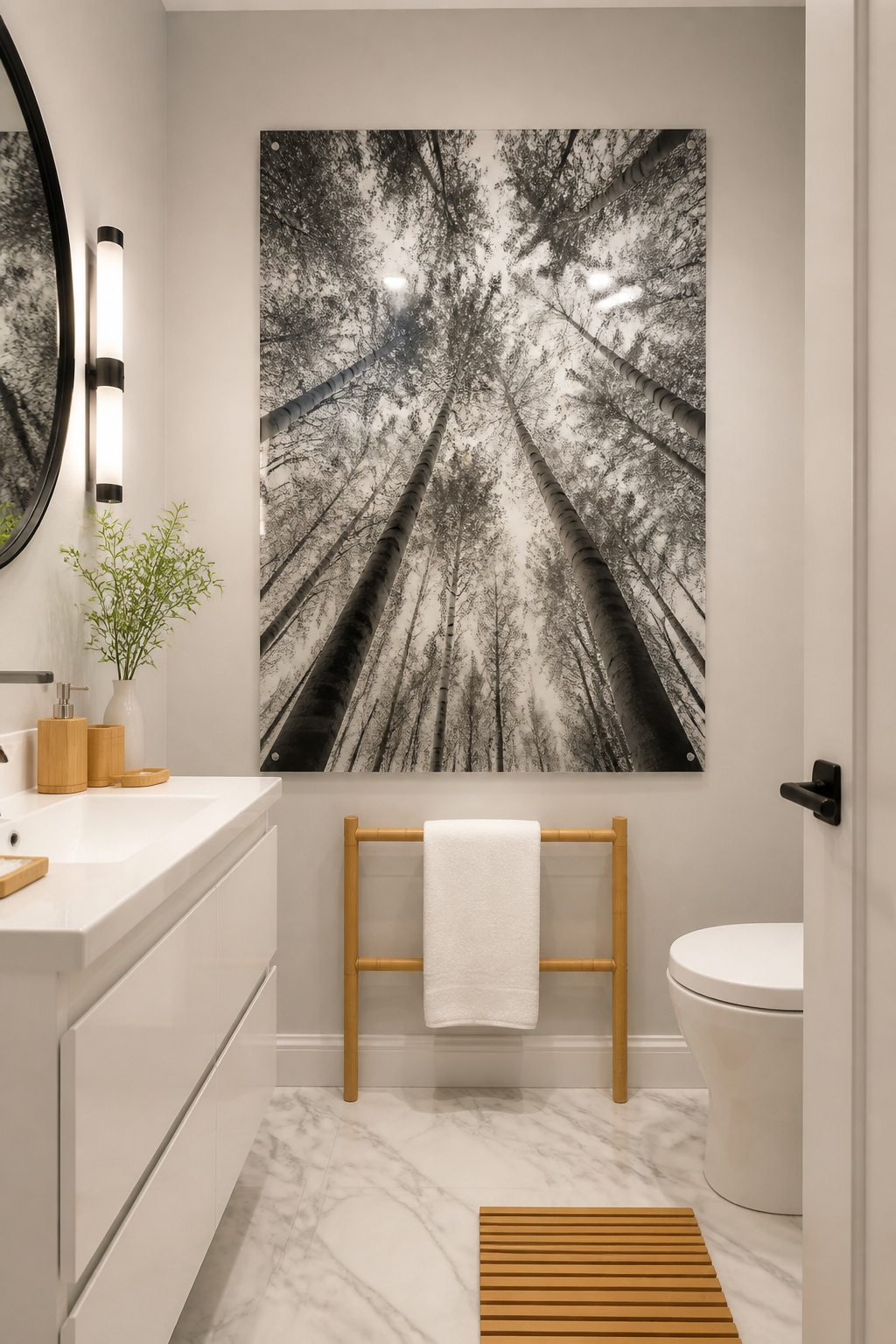A single large-format forest canopy photograph on an acrylic face mount becomes the whole visual story of a small bathroom — one strong bathroom art idea that outperforms any number of smaller pieces combined.