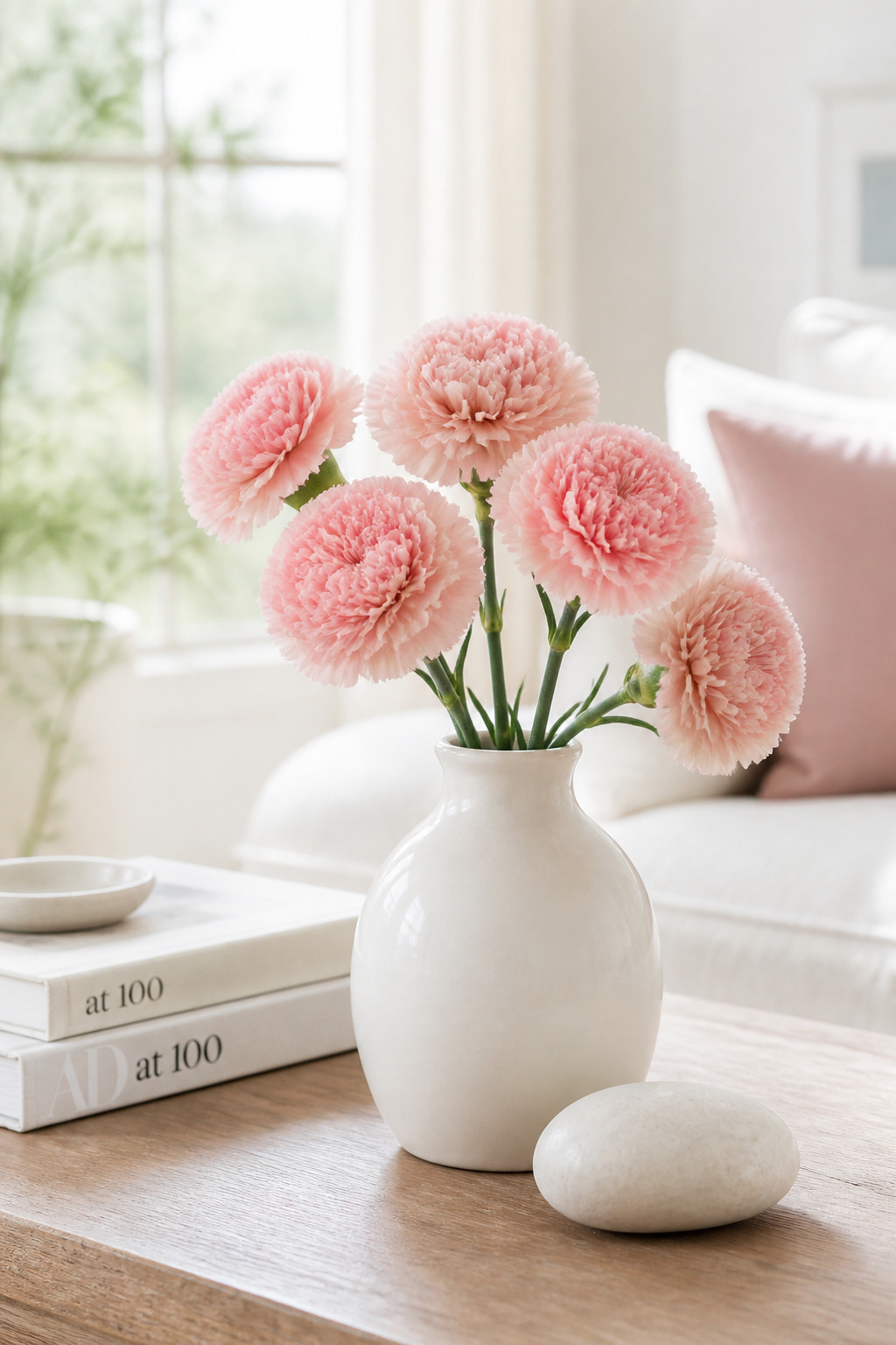 Fresh flowers or botanicals are the easiest high-impact refresh available for a coffee table — choosing long-lasting varieties like carnations, which hold for 14-21 days, extends the time between replacements.
