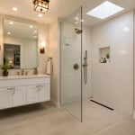 A complete small bathroom remodel in approximately 40 square feet: floating vanity, curbless walk-in shower with frameless glass, large-format porcelain tile, layered warm lighting, and period-appropriate craftsman hardware — every idea in this article working together in one finished space.