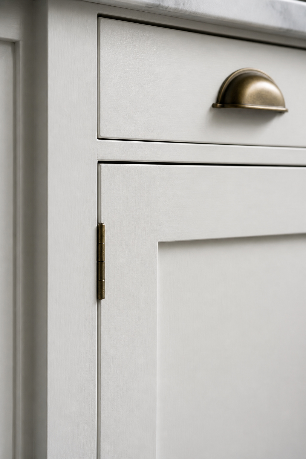 The 1/8-inch reveal around an inset door is the construction detail that separates period-authentic cabinetry from modern production work.
