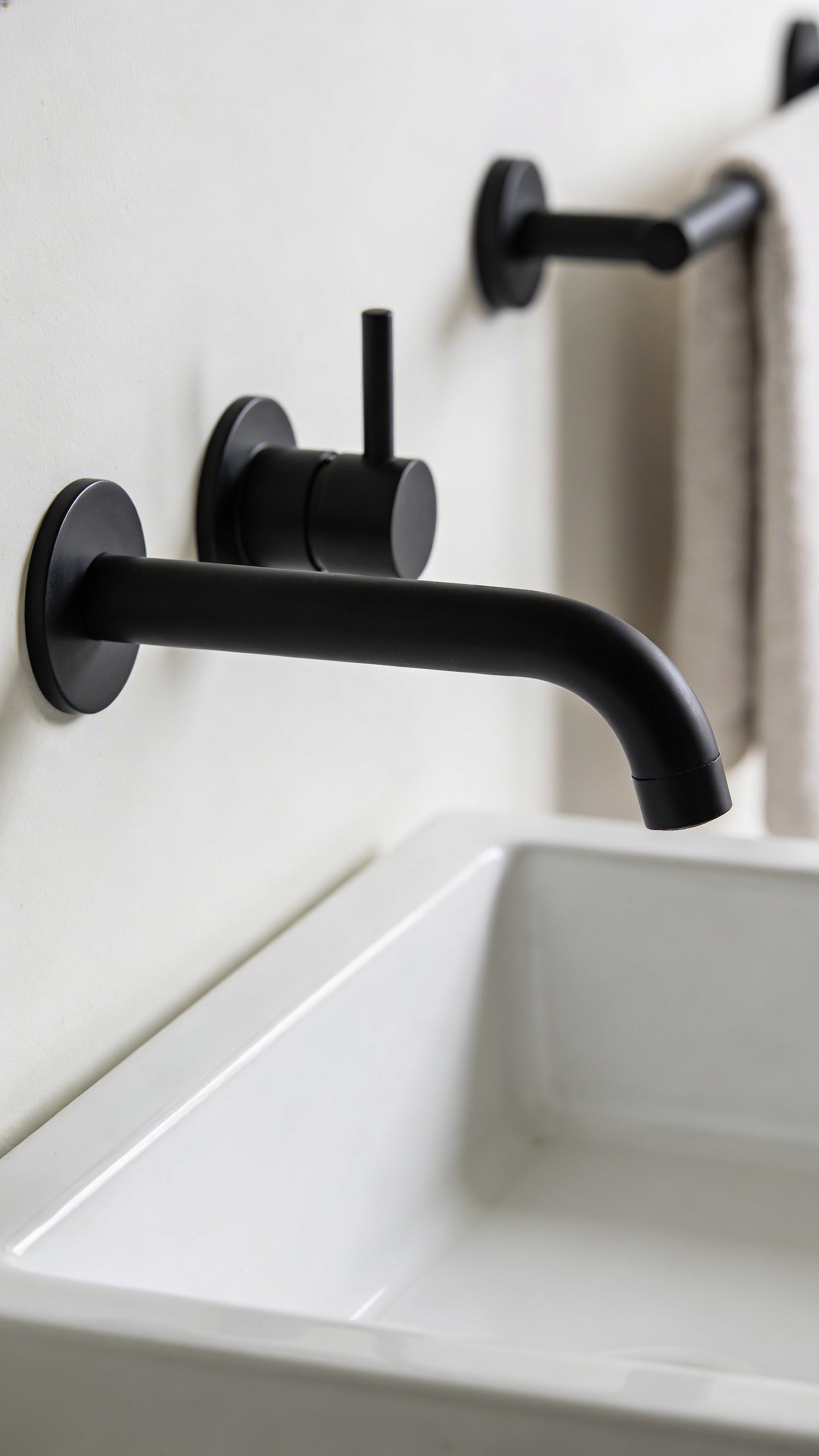 Matte black fixtures bring a cohesive design language to modern bathroom decoration — and they're far more forgiving of water spots than polished chrome.