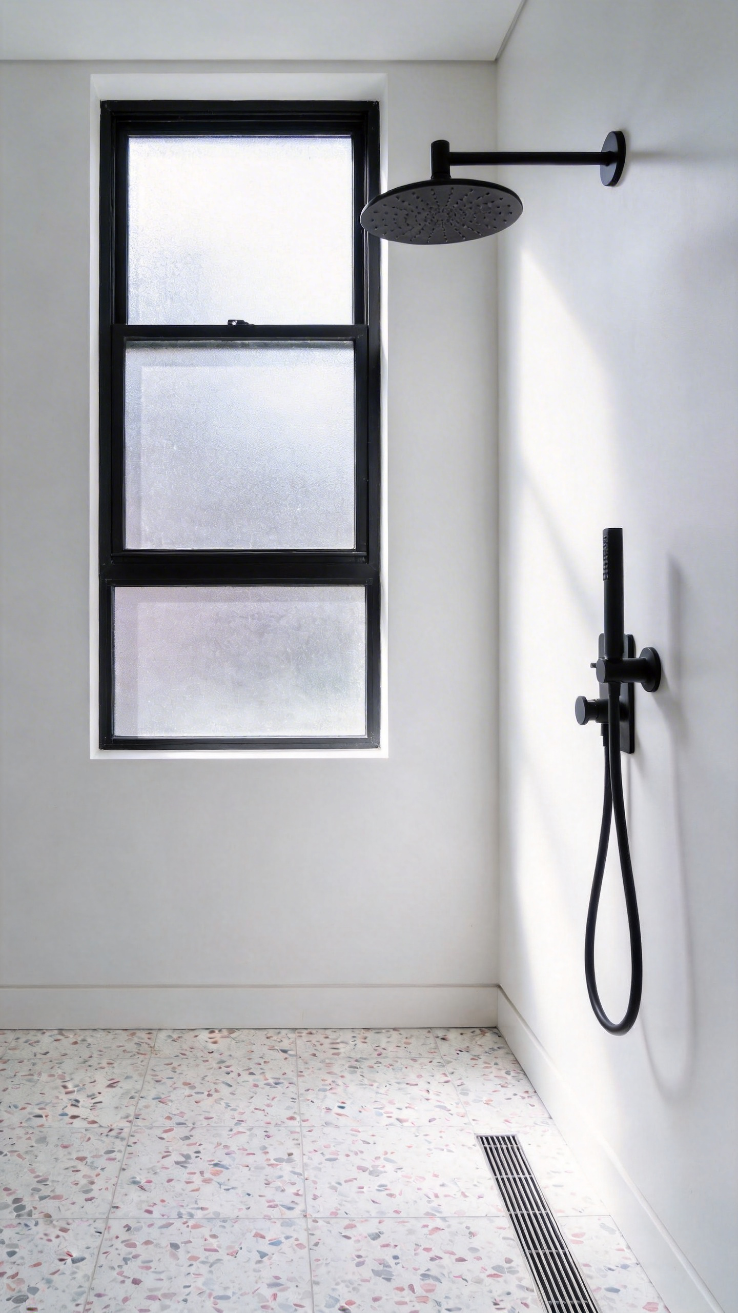 Terrazzo flooring makes a strong statement in modern bathroom decoration — the micro-chip contemporary version reads sophisticated rather than retro.