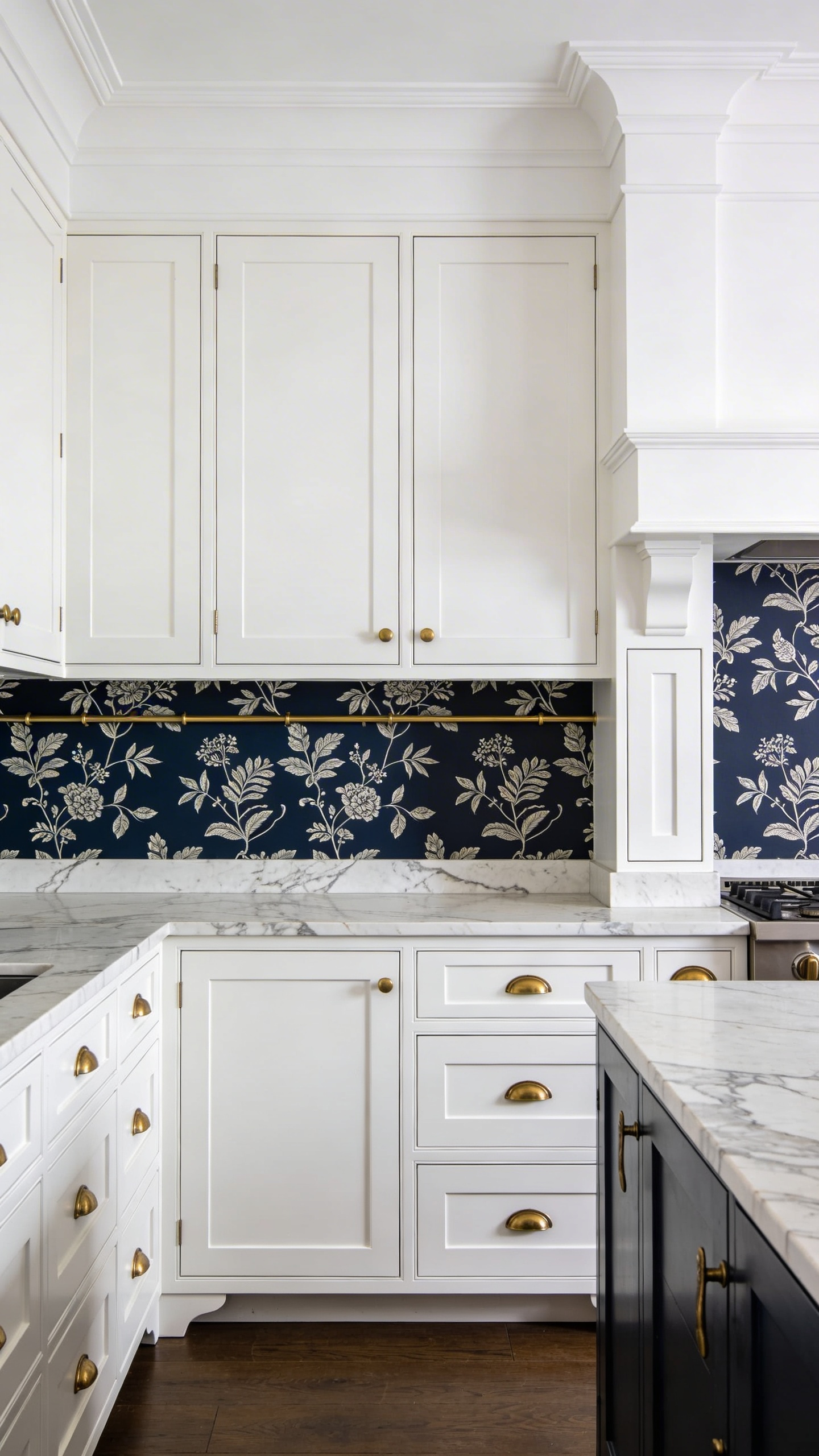 Botanical wallpaper below the dado rail with white paint above creates a horizontal rhythm that adds immediate architectural character — and keeps the upper walls clear for natural light to do its work.