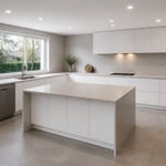 A complete minimalist kitchen at its best — handleless cabinets, seamless worktops, tonal palette, and large-format floors working together as a single resolved design.