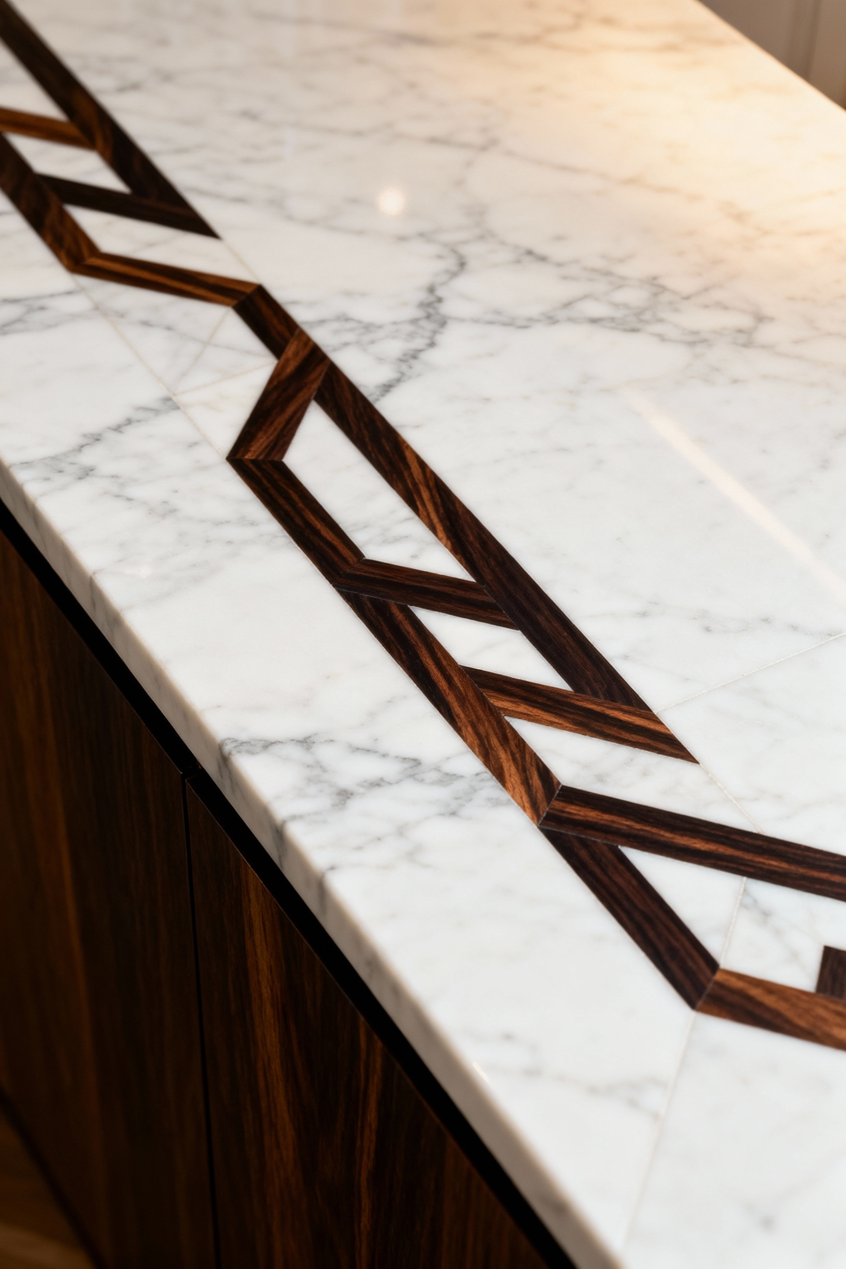 Luxurious kitchen countertop with intricate geometric inlay pattern made from dark Macassar Ebony wood embedded in white Calacatta marble, showcasing bespoke craftsmanship.