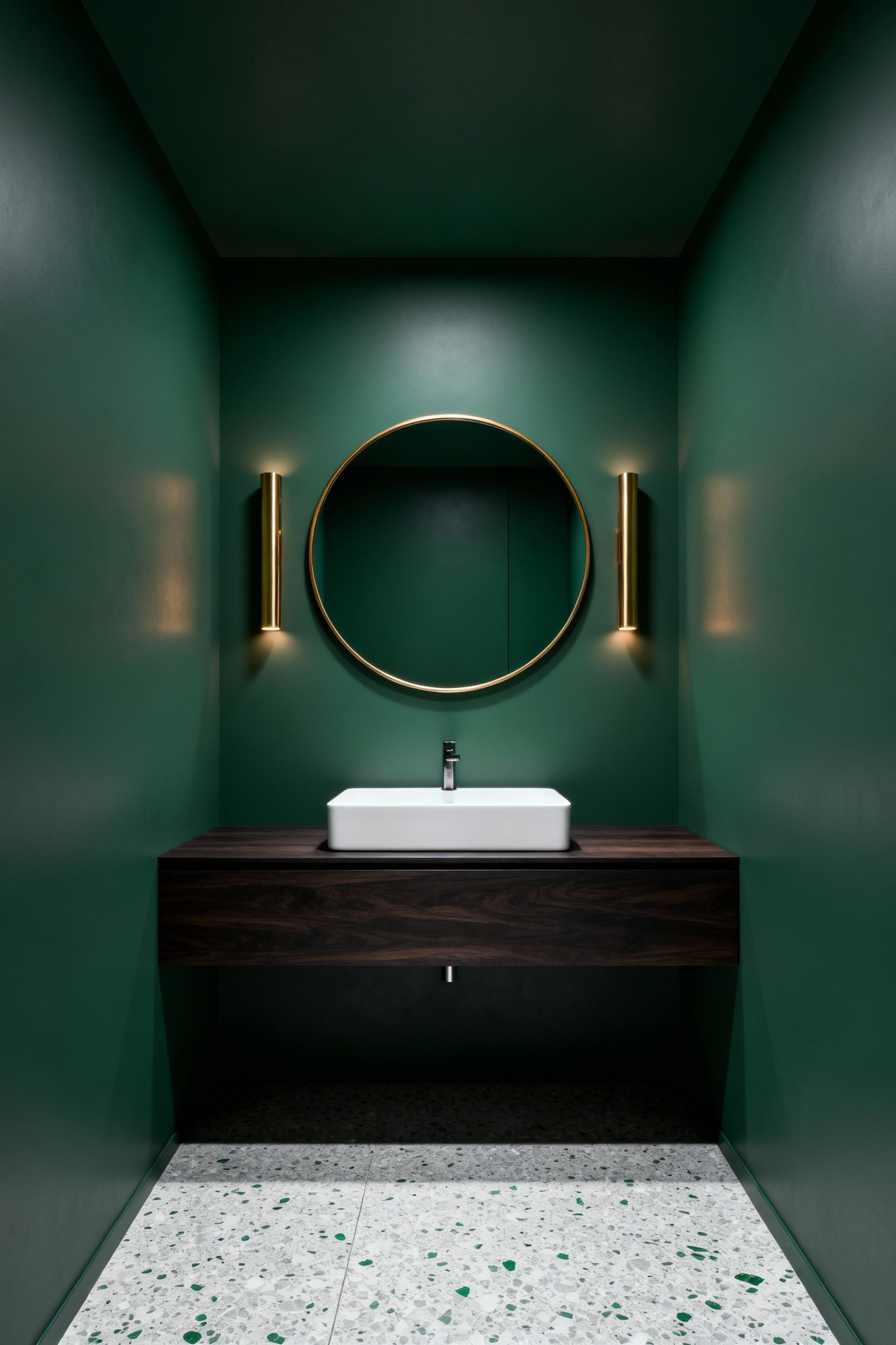 Small, high-end powder room where the walls and ceiling are continuously painted in matte sage green, featuring a floating walnut vanity and brass accents, demonstrating a seamless, cocooning interior design technique.