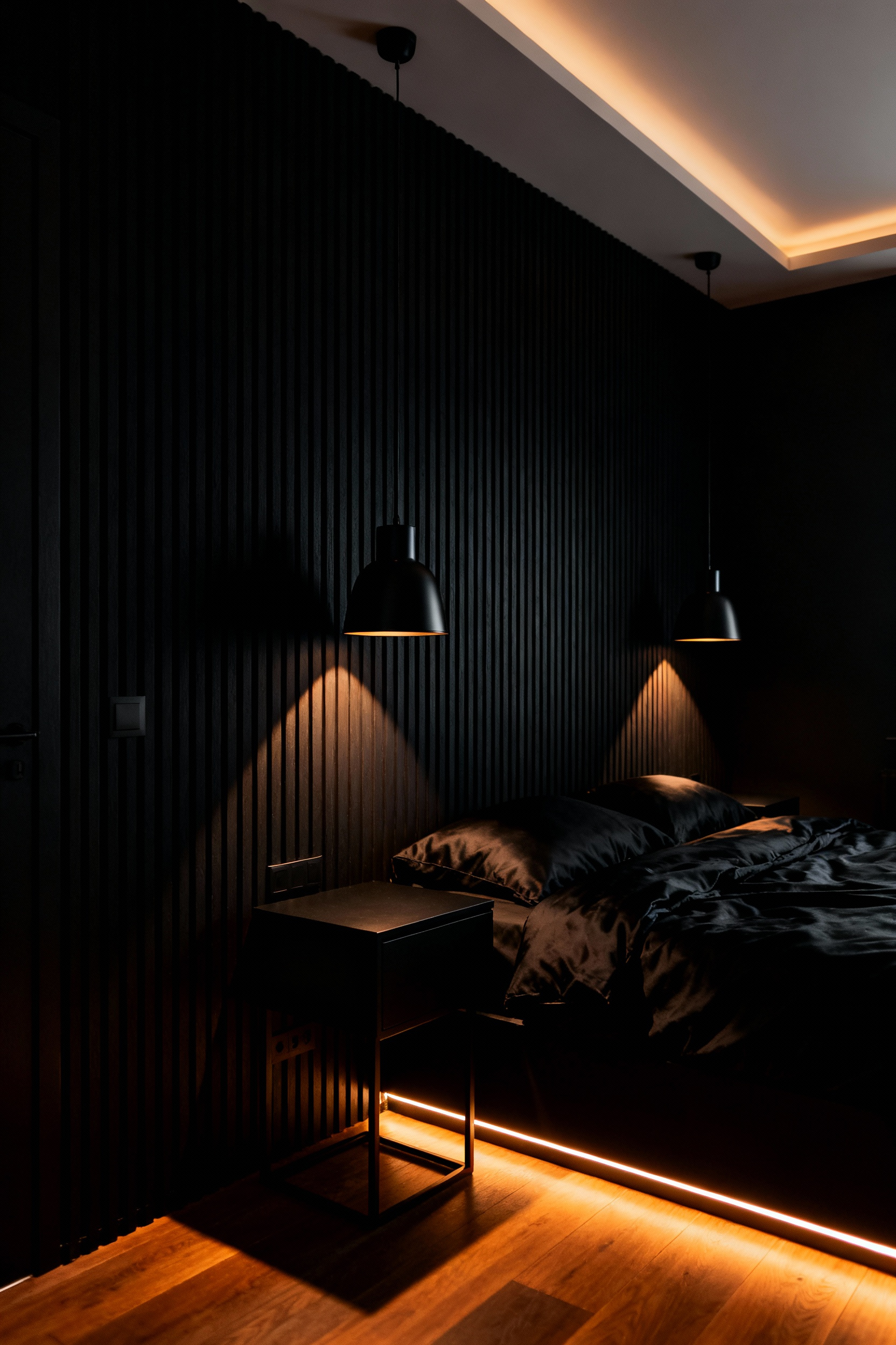 A luxurious modern bedroom designed with matte black walls and charcoal bedding, dramatically illuminated by multiple low-intensity, very warm light sources mimicking a hearth glow for an intimate aesthetic.