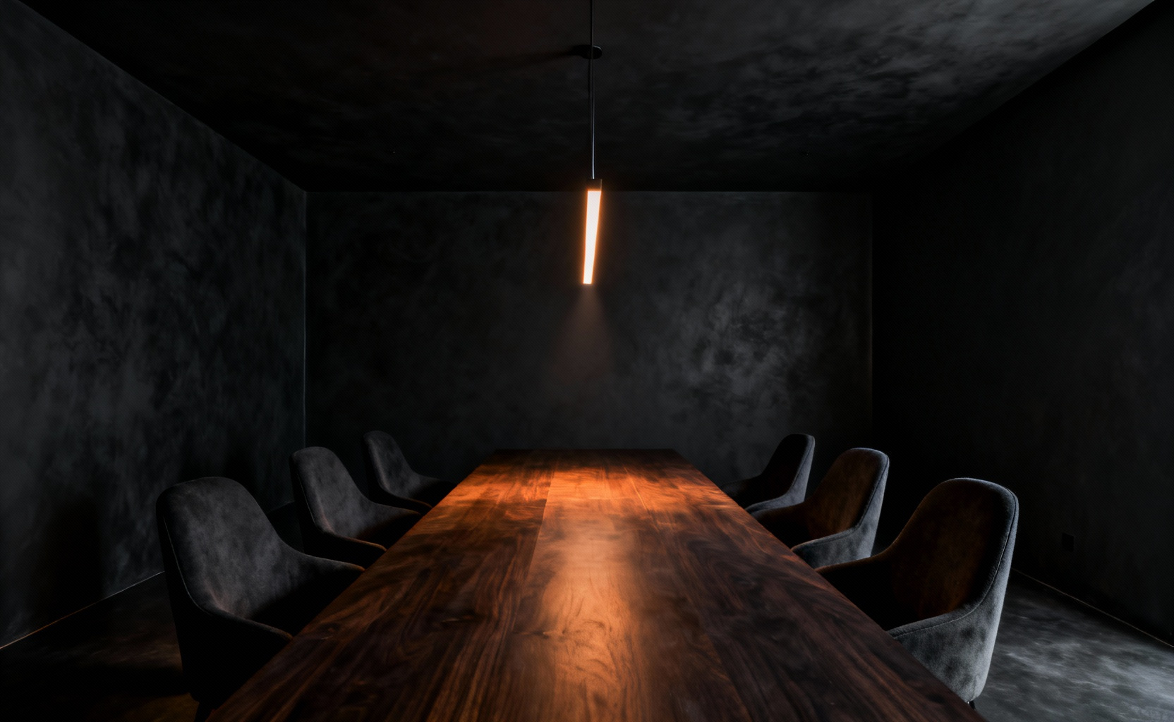 A hyperrealistic photo of a minimalist dining room with matte black walls and ceiling that absorb light, giving the illusion of limitless depth and a dramatic, cocoon-like void, lit only by a warm pendant over the dark wood table.