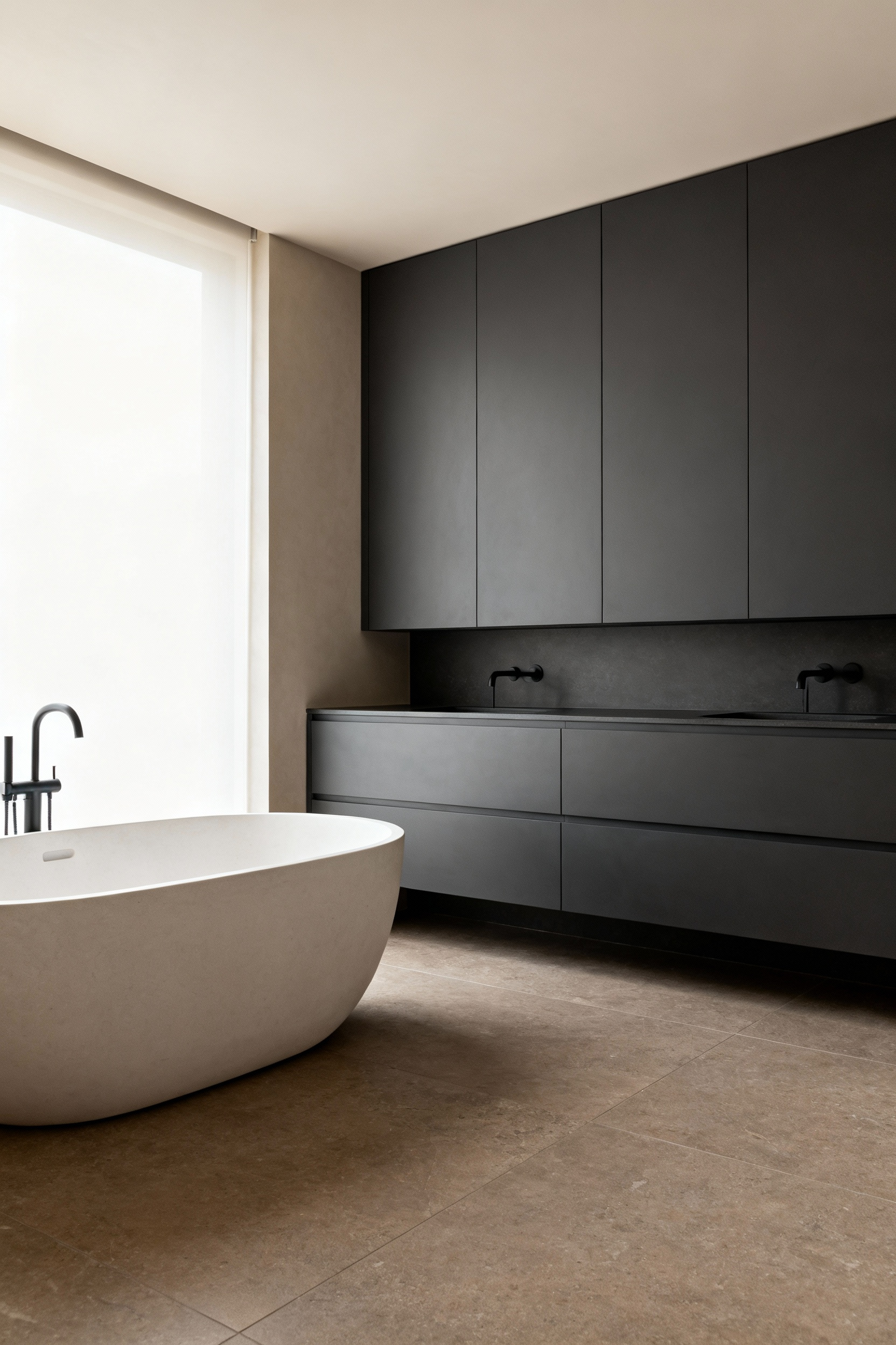 A modern, minimalist bathroom focusing on matte finishes, including a charcoal gray vanity and a matte white soaking tub, utilizing diffused light to create a deeply relaxing, glare-free environment.