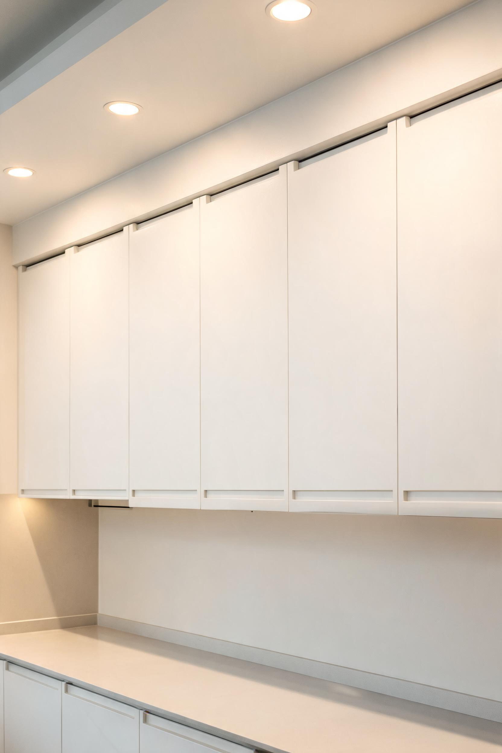Handleless cabinetry defines contemporary kitchen design — but the choice between J-pull, push-to-open, and recessed groove has real everyday consequences worth understanding before you commit.
