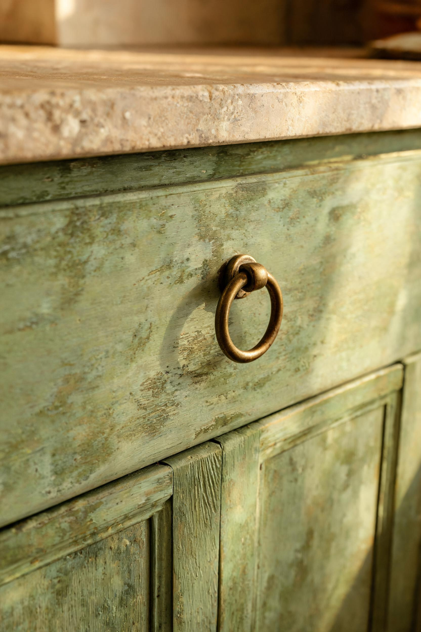 Limewash applied over a green base coat produces a layered, organic surface that mimics centuries of paint accumulation — authentic character that paint alone cannot replicate.