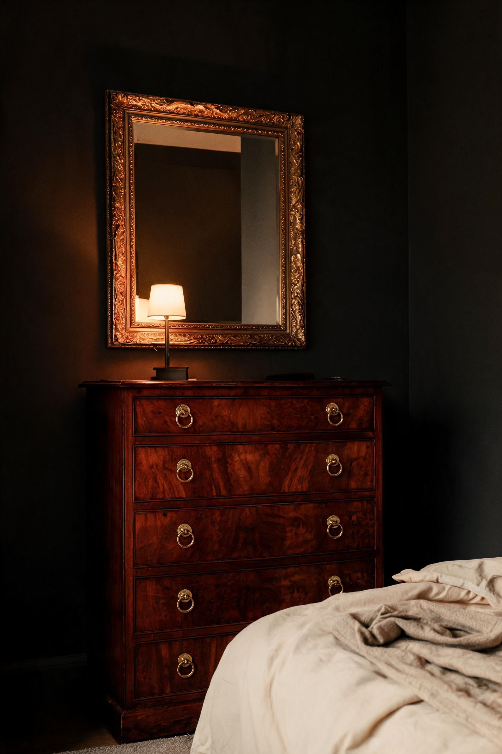Dark mahogany in a bedroom creates the kind of visual depth that takes years to achieve with paint or textiles — a chest of drawers in this species anchors the room instantly.