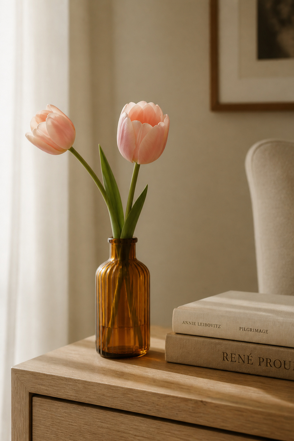 Two grocery-store tulip stems in a thrifted amber bottle cost less than $5 and bring the quality of a season onto this end table.