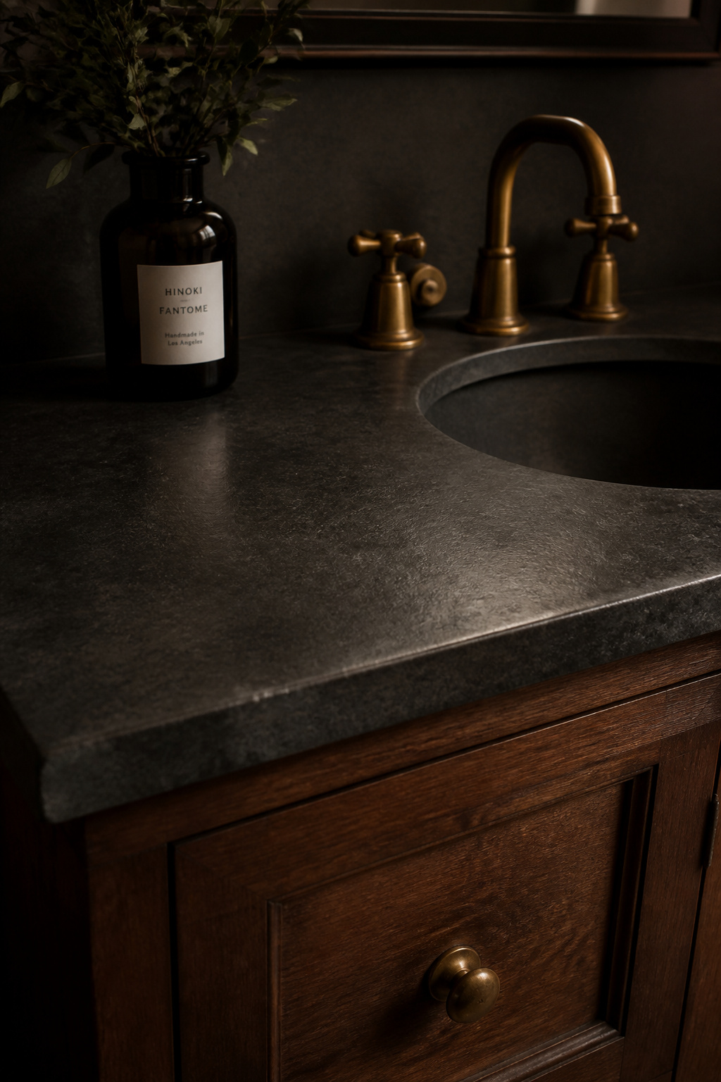 A dark soapstone countertop with a soft matte sheen built up from regular mineral oil treatments.