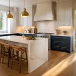 A complete kitchen remodel design featuring waterfall island, custom plaster hood, two-tone cabinetry, and zellige backsplash.