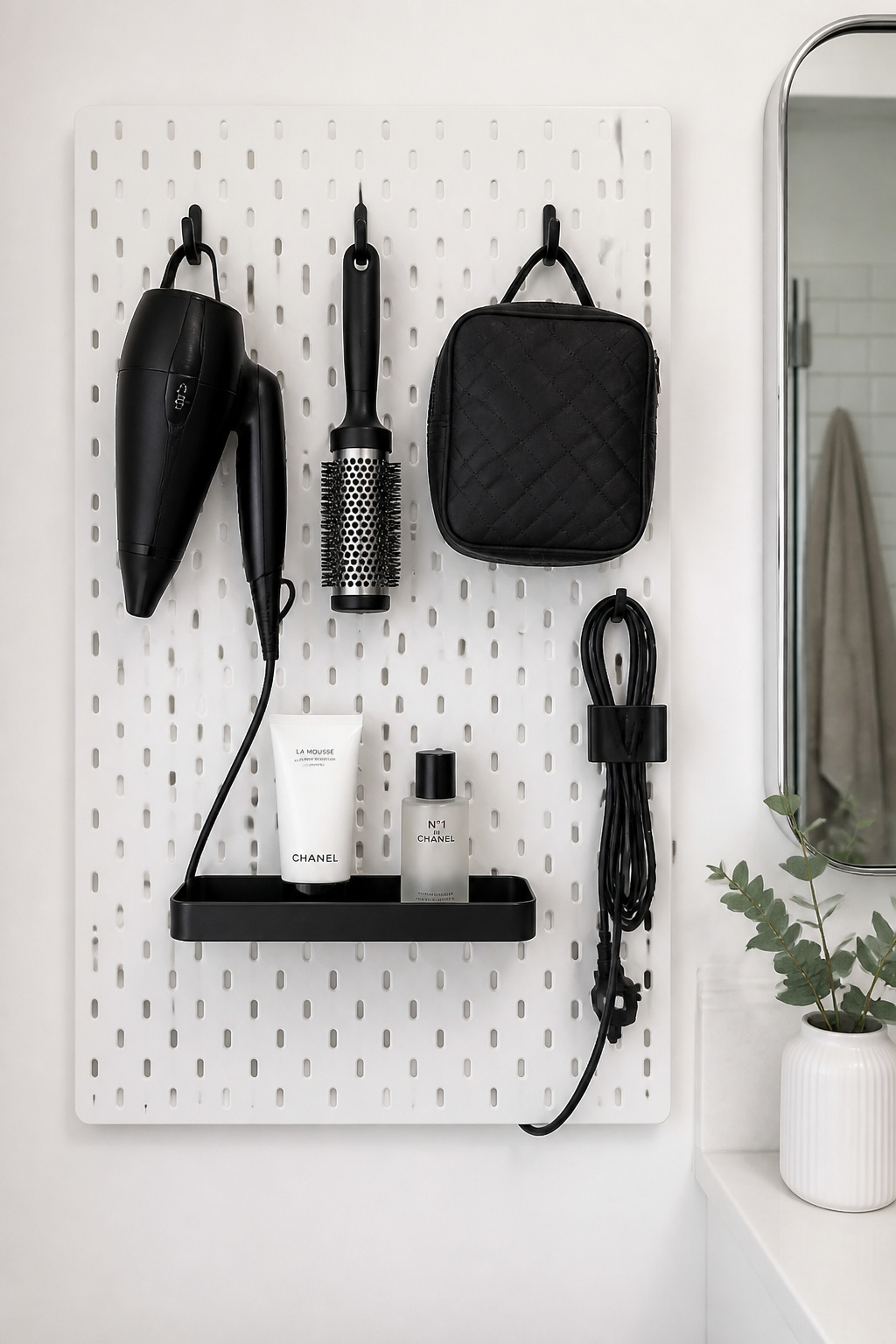 A pegboard or SKÅDIS panel converts a blank bathroom wall into a fully reconfigurable small bathroom storage system — one that adapts without new hardware every time your routine changes.