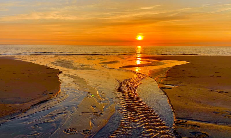 Zonsondergang op het strand